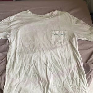 white Billabong short sleeve tee with design on back and front pocket